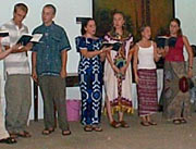 Students singing for their host families