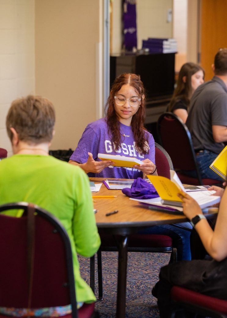 new students at table during orientation