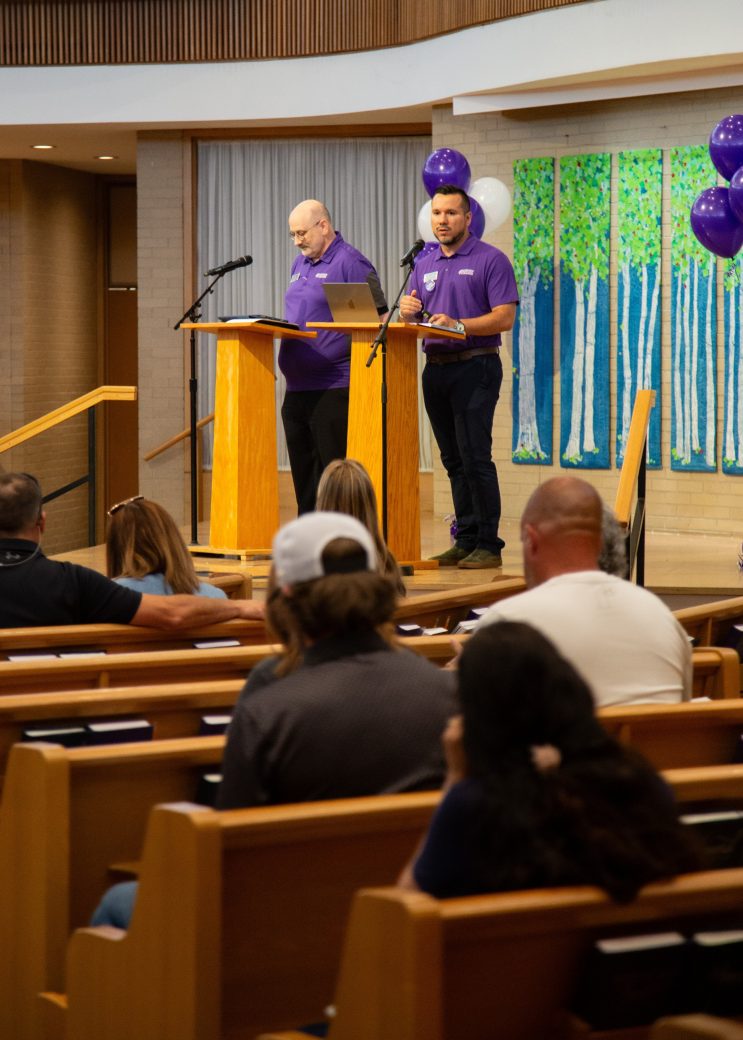 students listen in chapel during orientation visit