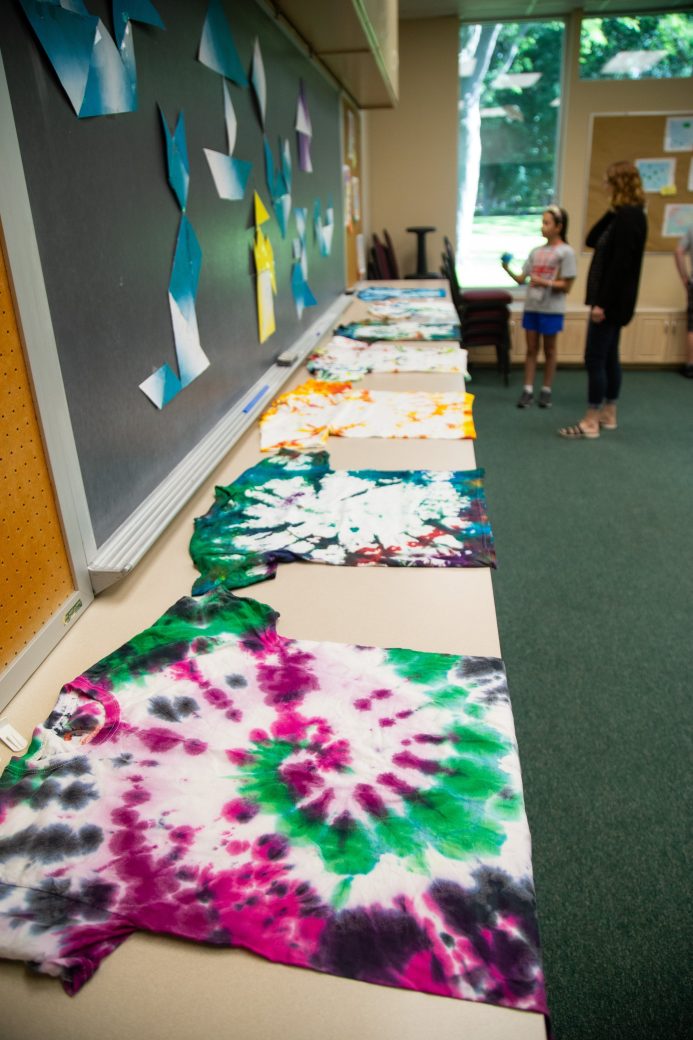 display of tie-died shirts from camp