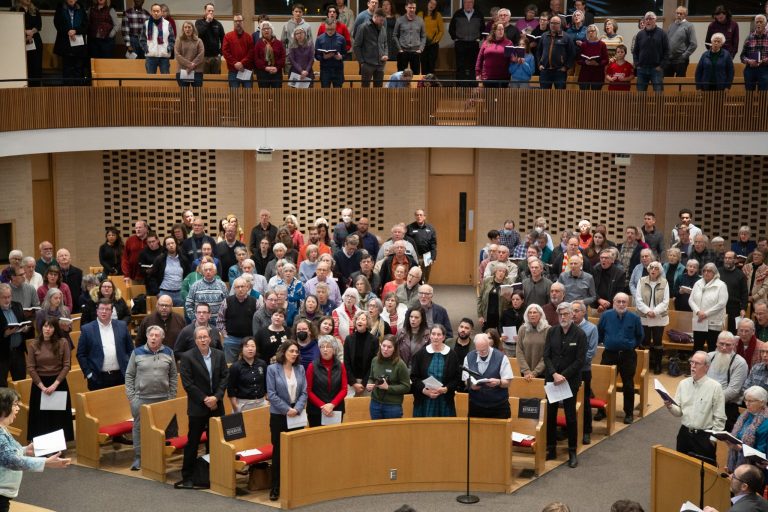 People singing in the Church Chapel in Goshen College