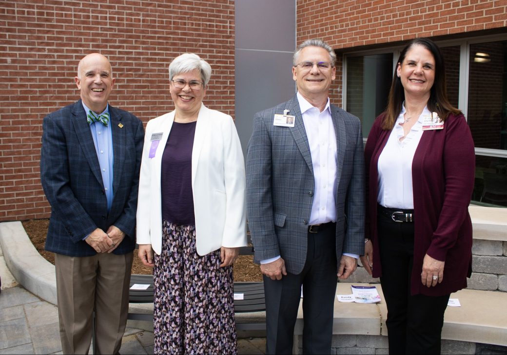 Goshen College President Rebecca Stoltzfus (second from left) with community leaders.