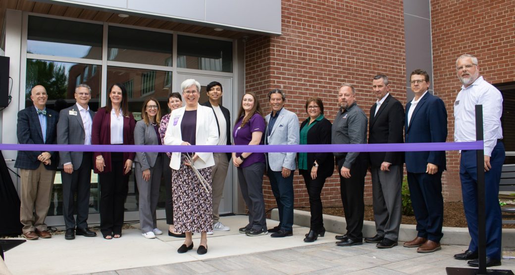 Goshen College President Rebecca Stoltzfus (center) is joined by others for the Westlawn ribbon-cutting event: (left to right) Hugh Davis, CEO of Greencroft Communities; Randy Christophel, CEO of Goshen Health; Julie Crossley, Chief Nursing Officer of Goshen Health, Gina Leichty, Mayor of the City of Goshen; Jewel Yoder, Goshen College Professor of Nursing and the Chair of the Department of Nursing and Public Health; Javier Reyes, Goshen College Student Senate President and sophomore nursing major; Laura Shoemaker, 2025 Goshen College valedictorian nursing graduate; Gerry Horst, Chair of the Goshen College Connected Cause Campaign Steering Committee and Board Member; Sarah Reese, interior designer at Credo; Lydell Troyer, DJ Construction Chief Operating Officer; Pete McCown, President of the Community Foundation of Elkhart County; Nick Kieffer, President and CEO of Goshen Chamber of Commerce; and Brian Mast, Goshen College Director of Facilities and renovation project manager.