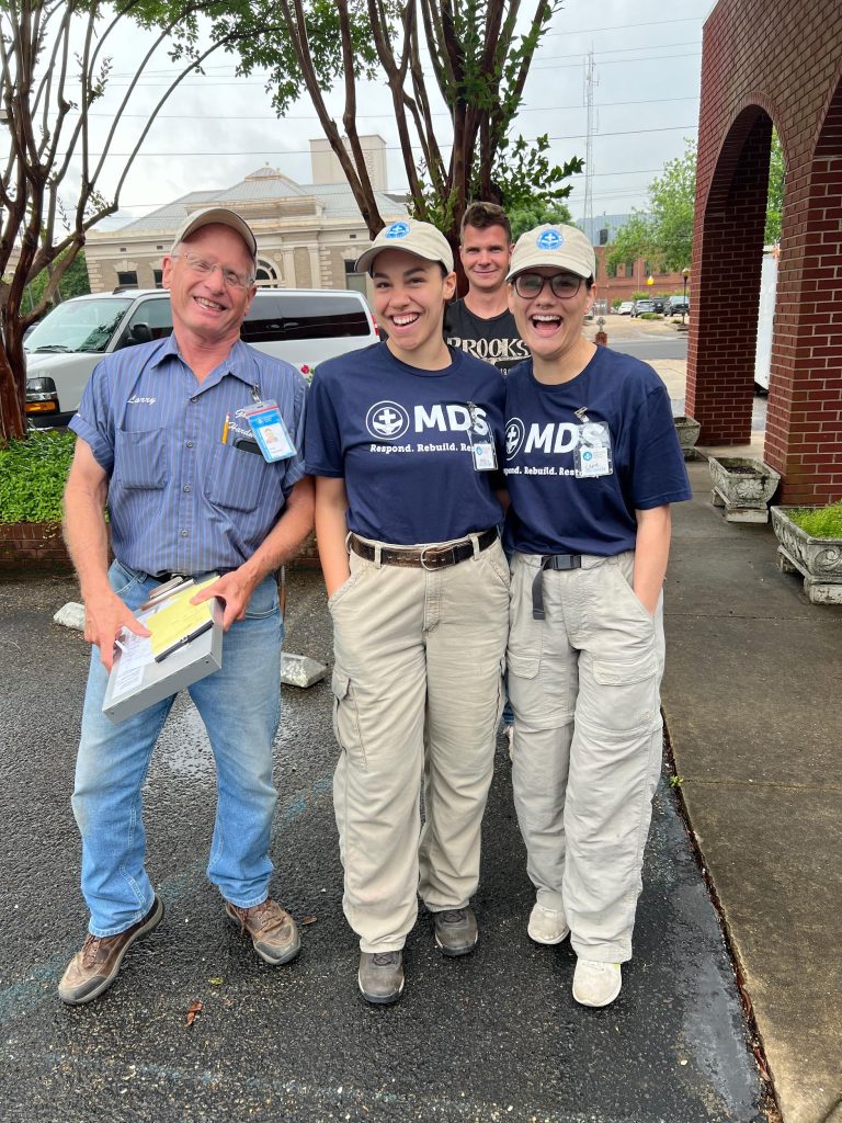 Aysia Adkins with two others in MDS t-shirts