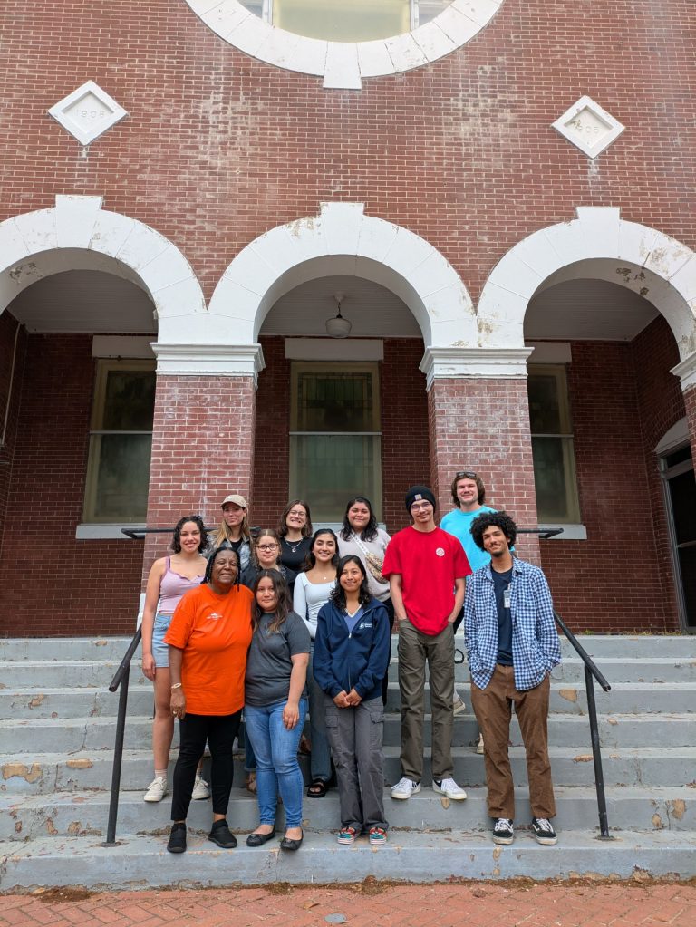 Group of mixed ethnicity students on stone stairs