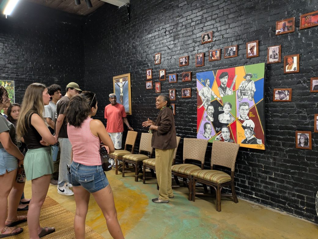 Group of students looking at an art piece