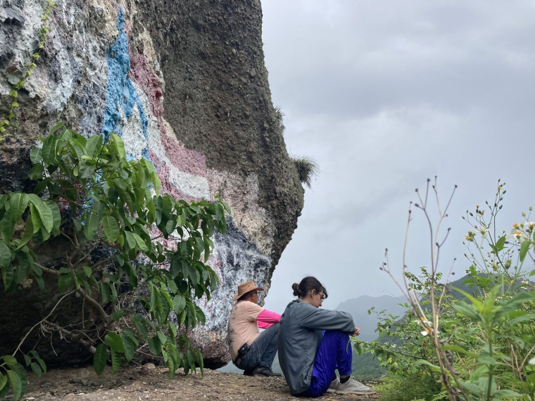 Women sitting on a mountain edge