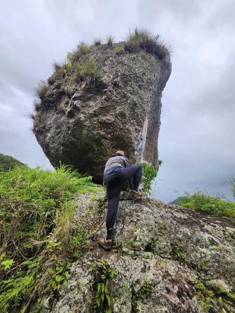 Student climbing up mountain