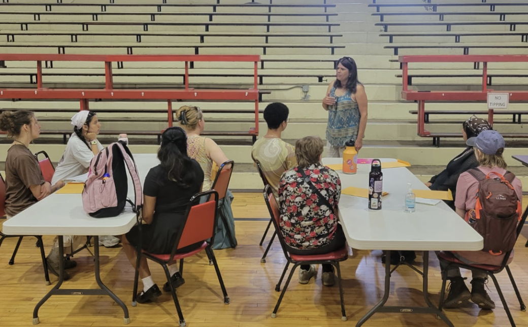 Students gather in the old Peru high school gym as Sarah Siders presents Miami history.