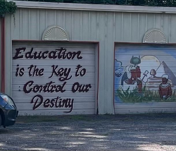 “Education is the Key to Control Our Destiny.” written in graffiti