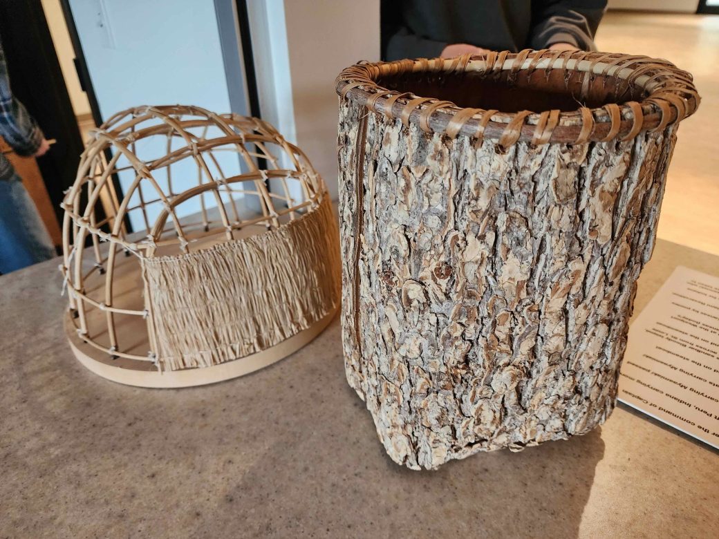 Wigwam model and an elm bark basket.