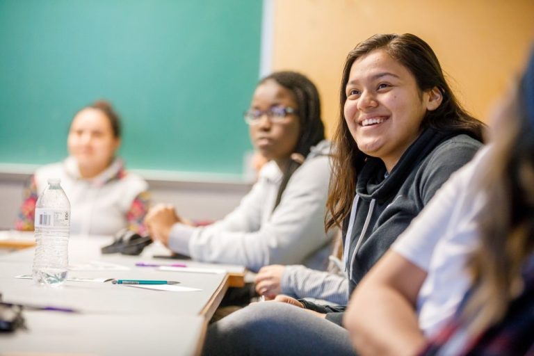 Student smiling in a GC class