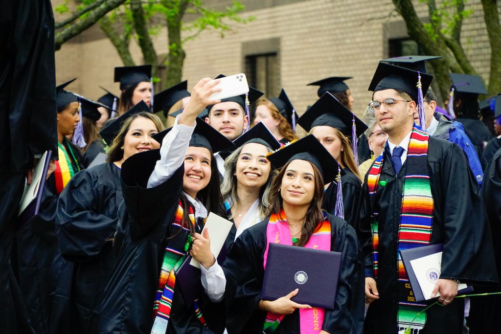 Students taking a selfie during graduation
