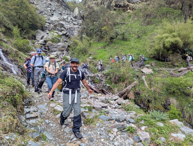Students climbing down a mountain in India