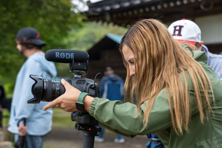 Student operating a camera