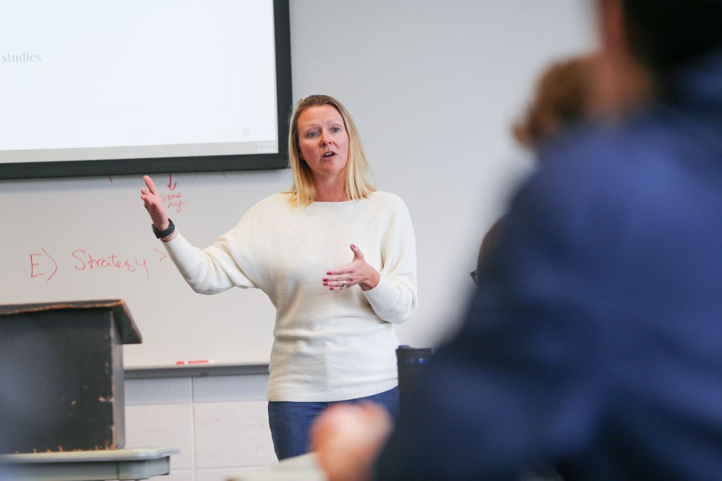 Professor of business giving a lecture in a marketing class