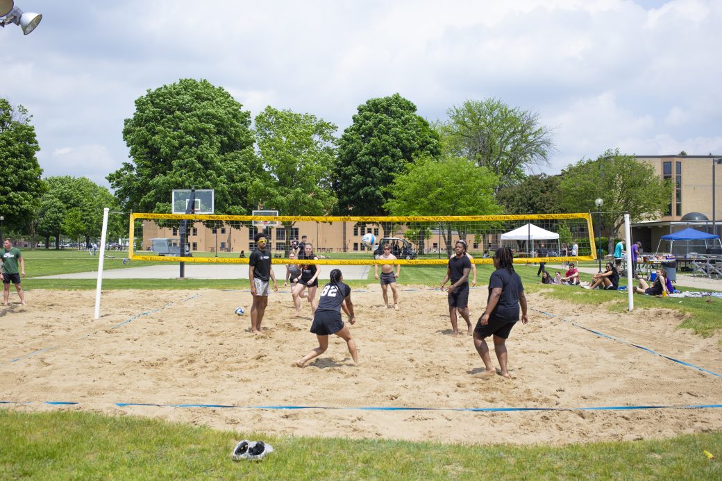 GC students playing in an intramural sand volleyball tournament