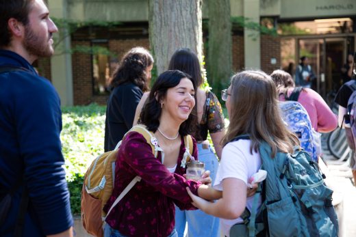 Students smile and talk