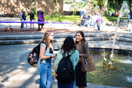 Students smile and talk