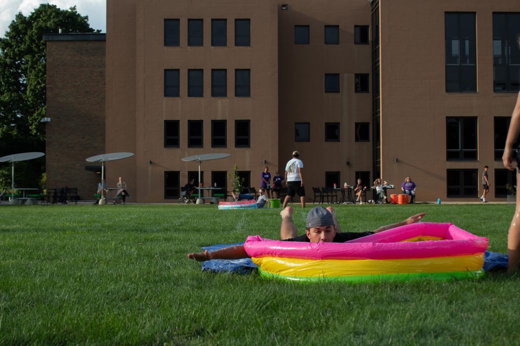 Students play slip-and-slide kickball