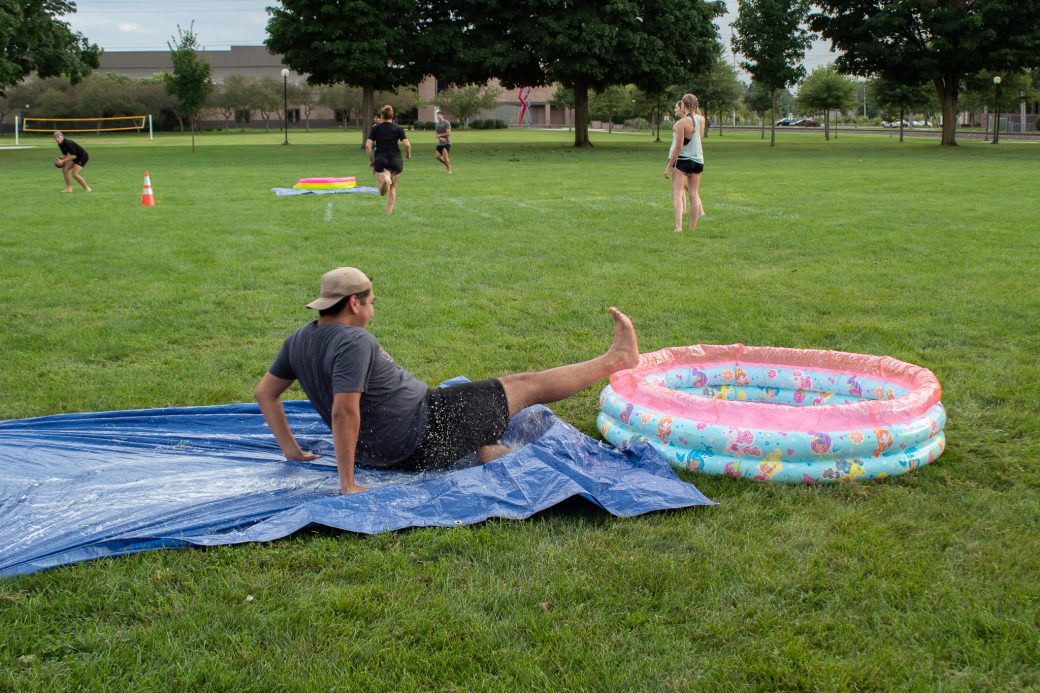 Students play slip-and-slide kickball