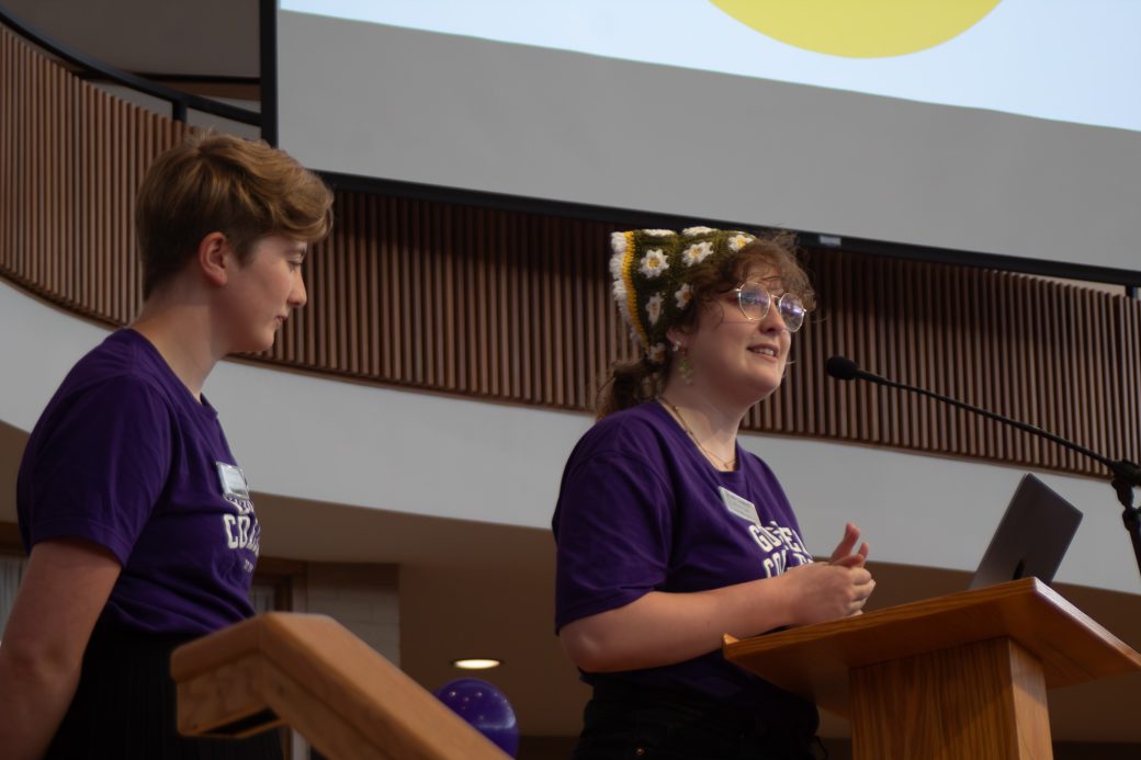 Students speak at a podium