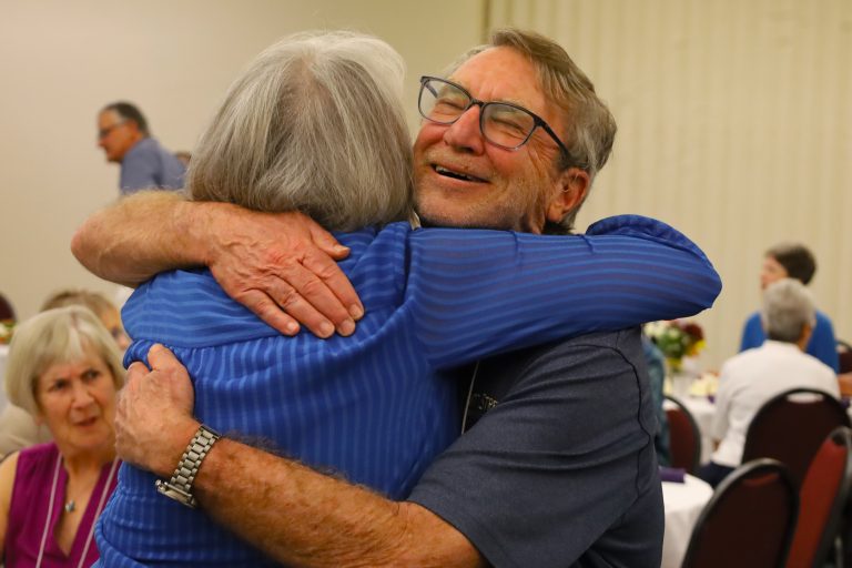 old friends embrace