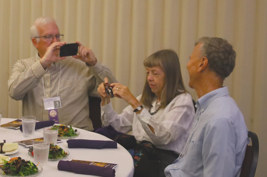 people taking pictures of each other.