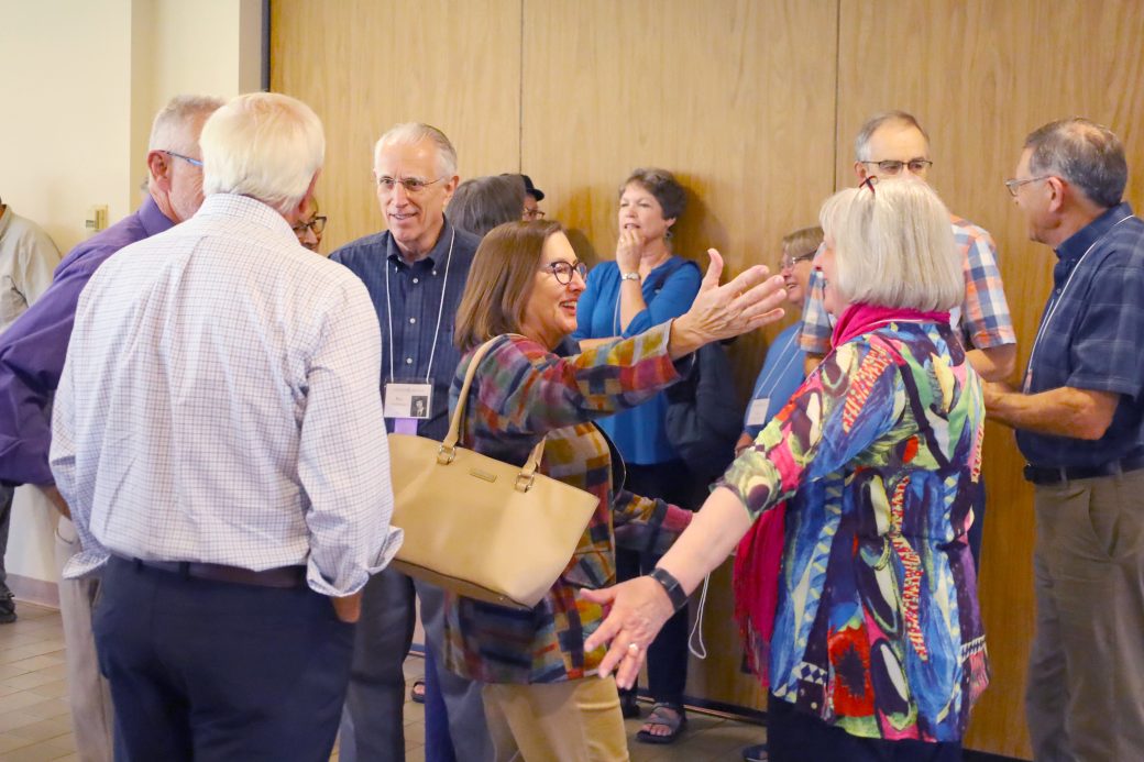 old friends reunite with an excited hug
