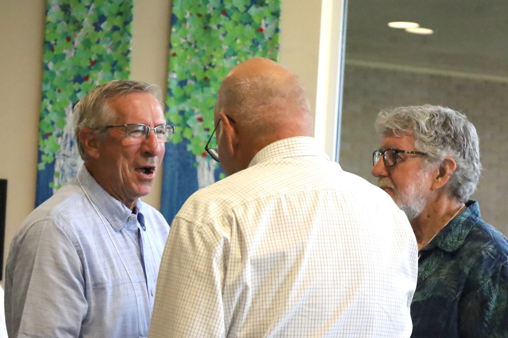 group of men chatting and laughing