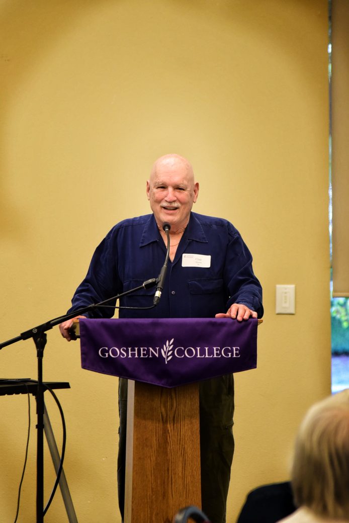 nursing alumnus speaking at podium