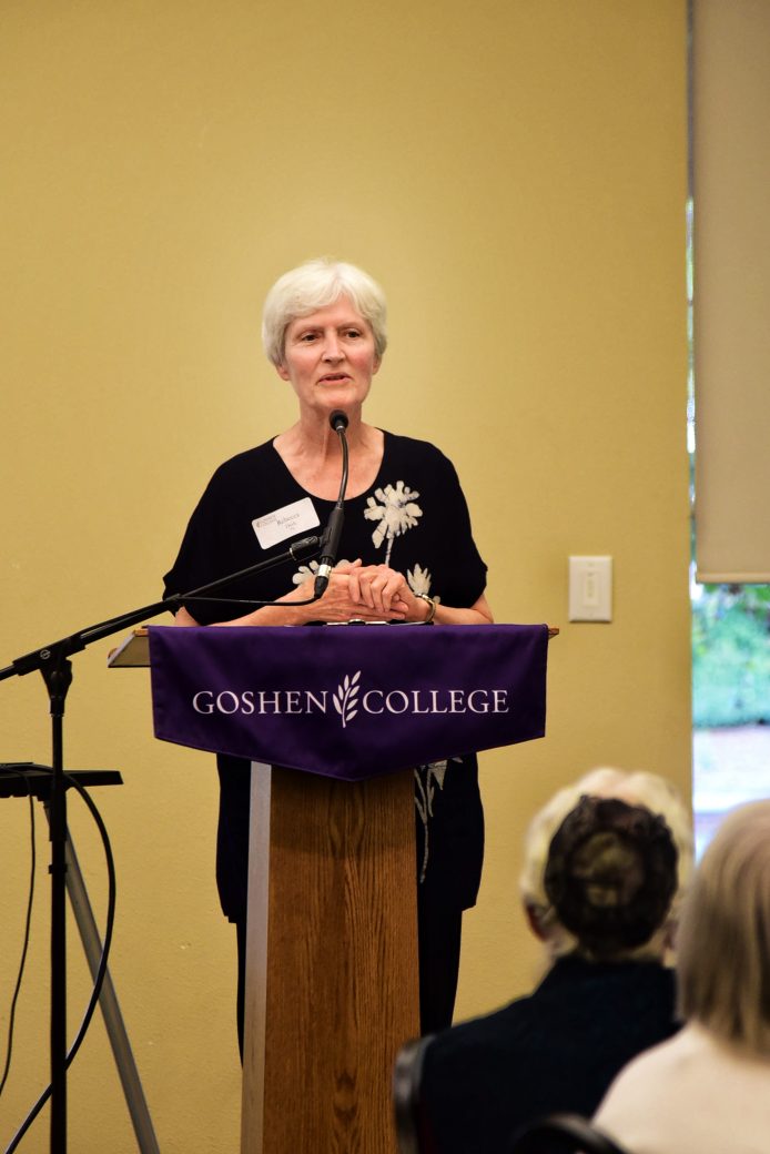 nursing alumna speaking at podium