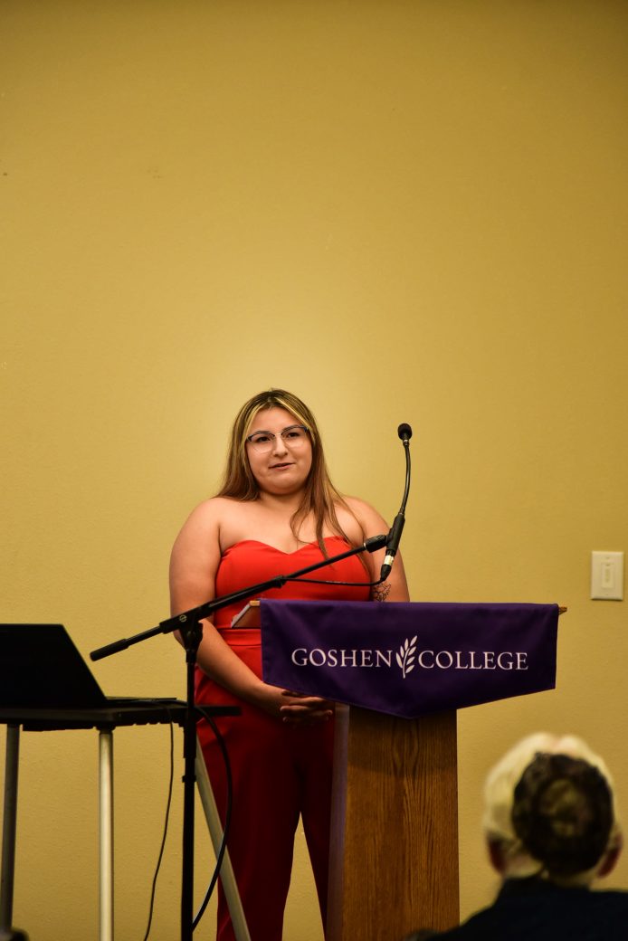 nursing alumna speaking at podium
