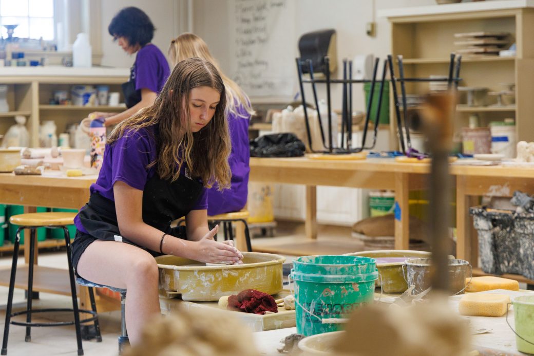 Summer camper at the ceramic wheel