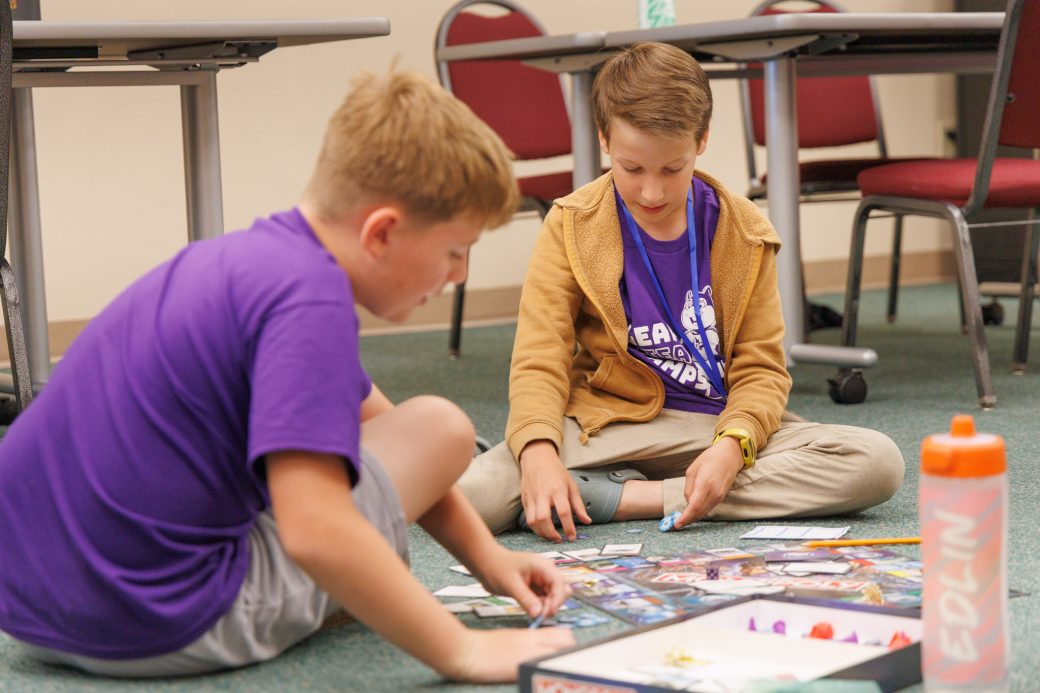 Two campers playing board games
