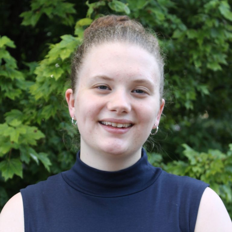 headshot of Sophia Kauffman outside wearing a black turtle neck tank.