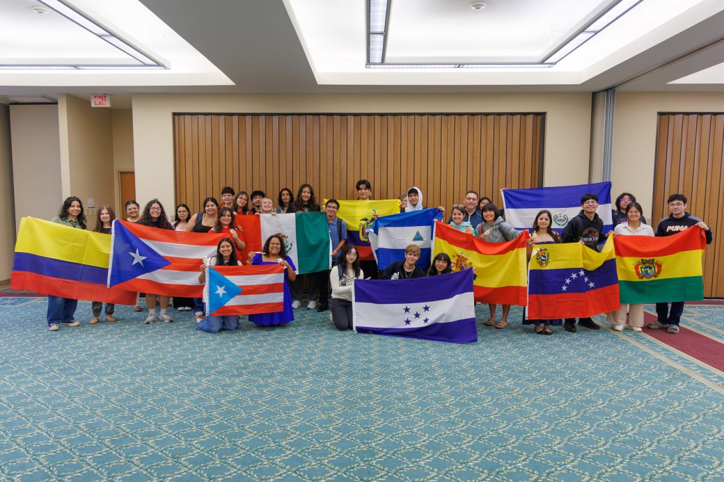 Hispanic students pose with their country flags
