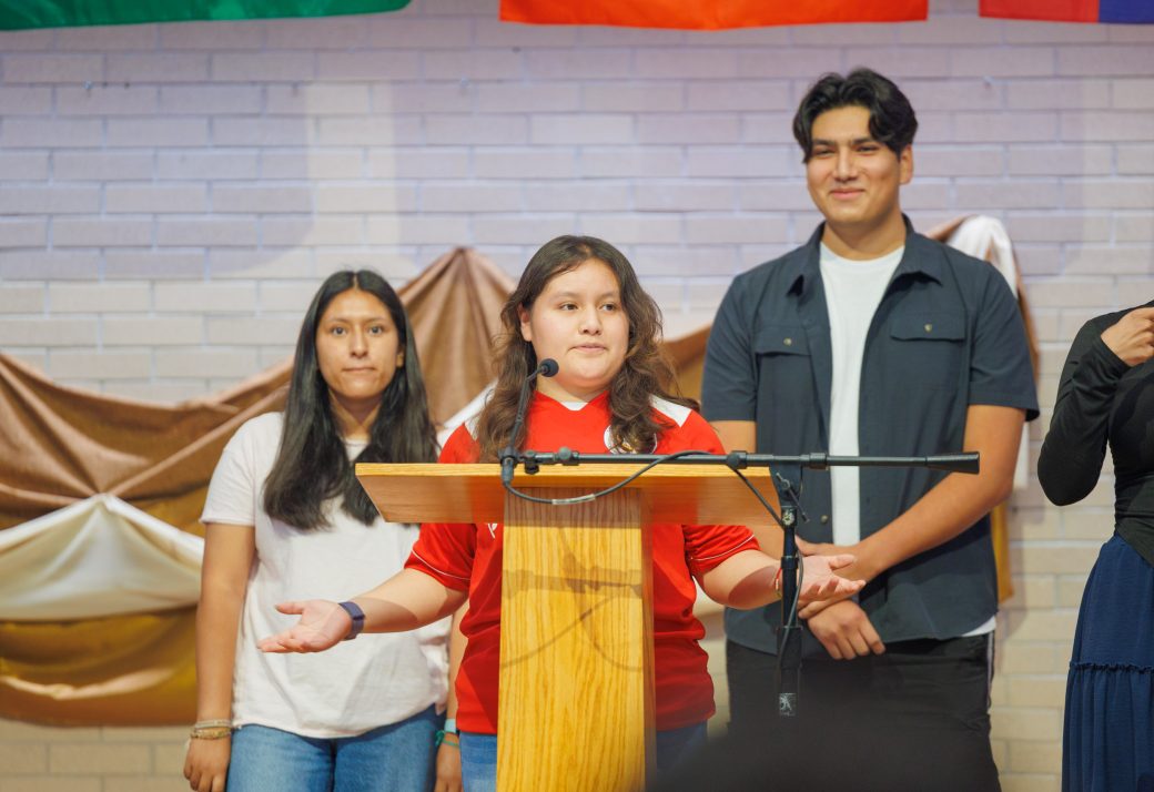 Summer Cuatepotzo Perez speaking during Hispanic Heritage Month Convocation