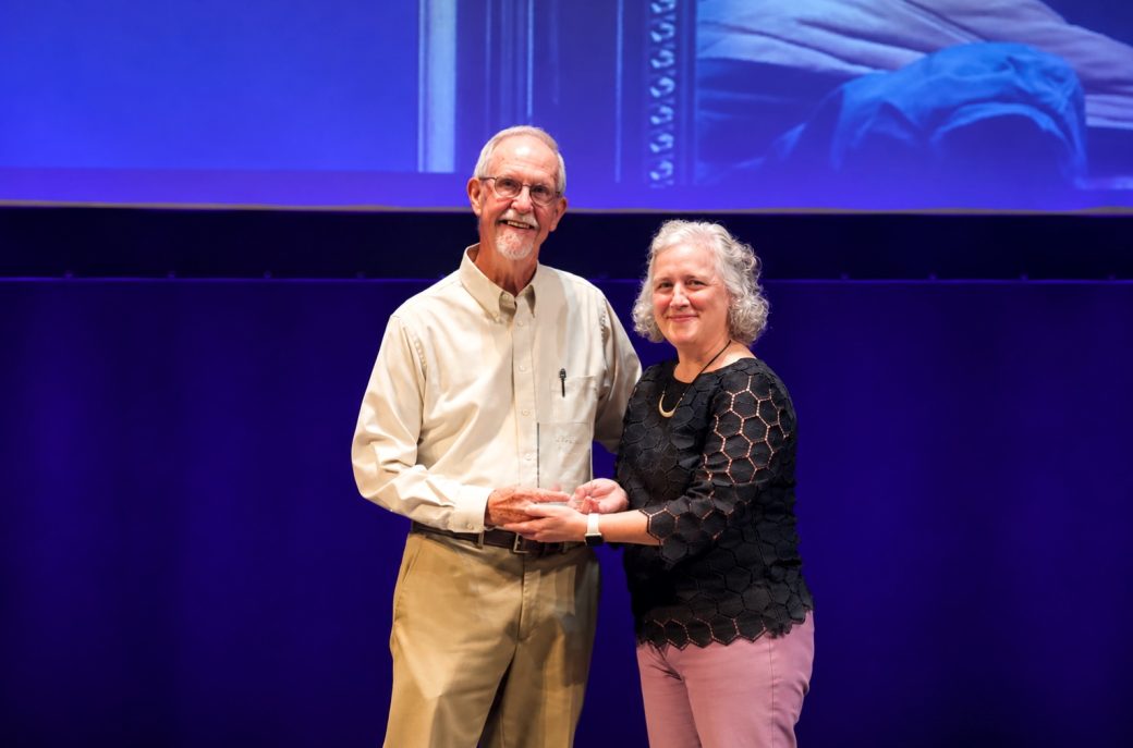 Jodi Beyeler giving an award
