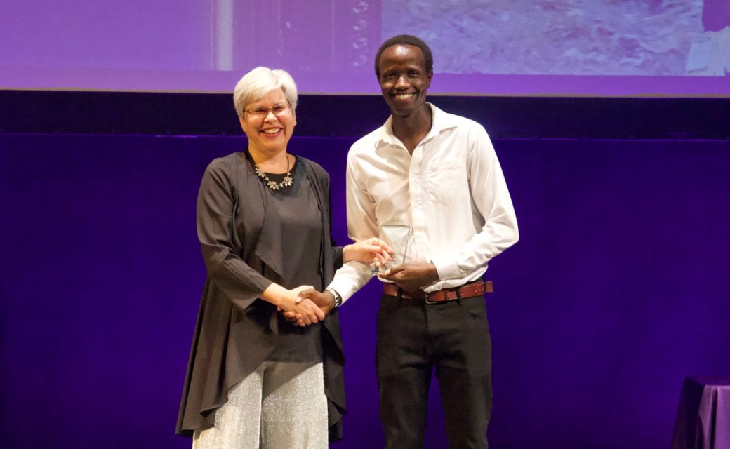 President Rebecca Stoltsfus handing award to student at LEAFYs award show