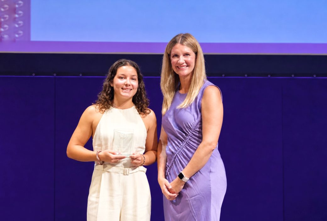Anna Groff handing award to a student
