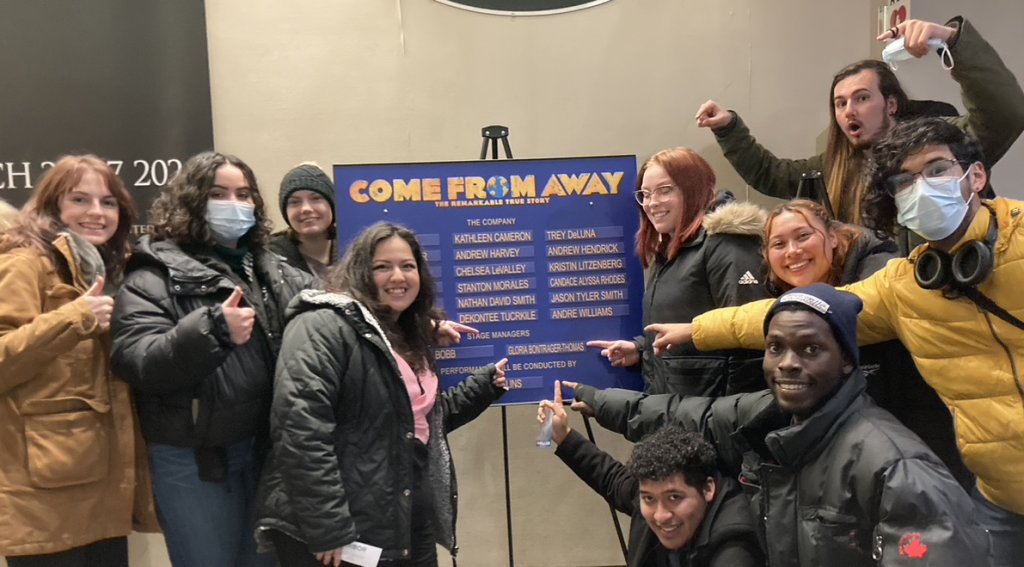 Students find their friend's name on the announcement sign