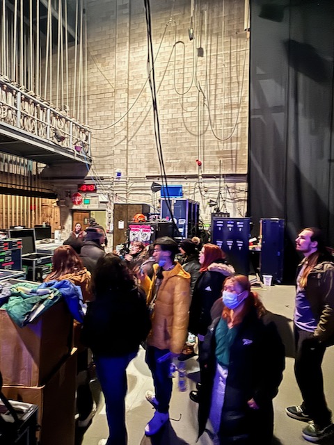 students respectfully explore the backstage environment
