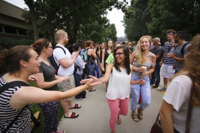 Students welcome each other at the beginning of a new academic year in August 2016. 