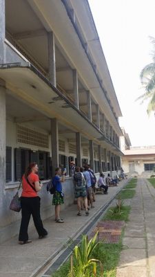 The group touring the Tuol Sleng grounds