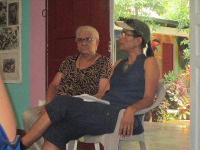 The director of the museum/a mother who lost a son shares difficult stories with our group.