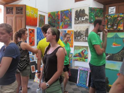 Emily S. and others admiring the colorful and creative artwork of local artists.