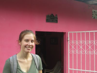 Emily outside her host family home