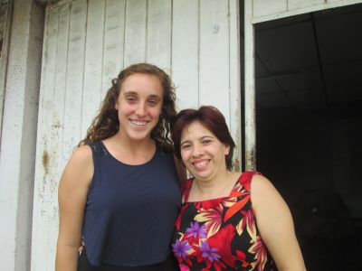 Maddie with her service host mom, Fatima, outside their home.