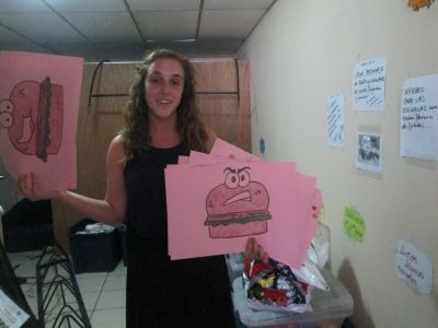 Explaining some of the work she is doing with the Bibliobus. Maddie helped create the story of the angry hamburger as a part of a learning unit on unhealthy food.